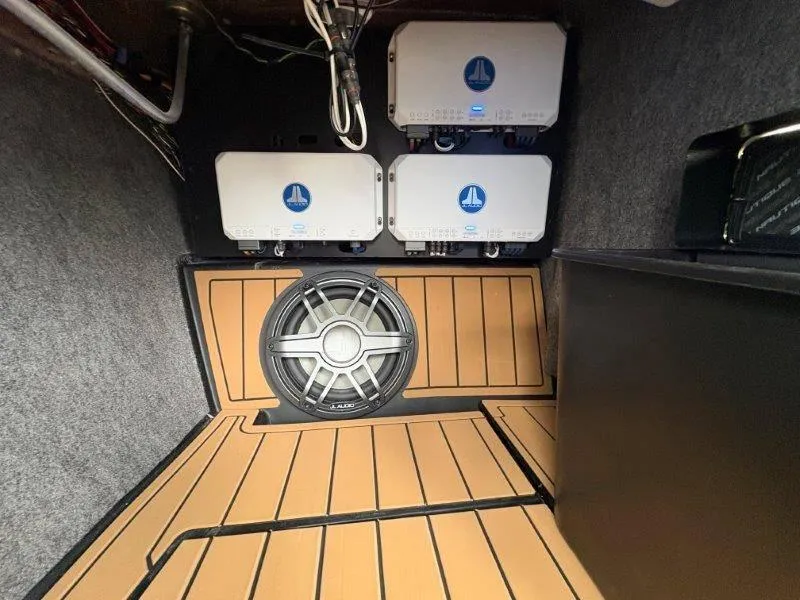 Slide: The Image of 2025 Nautique G25 audio system with JL Audio amplifiers and subwoofer. - 39