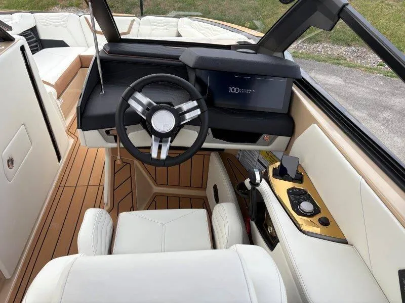 Slide: The Image of 2025 Nautique G25 boat interior with modern steering and dashboard design. - 43