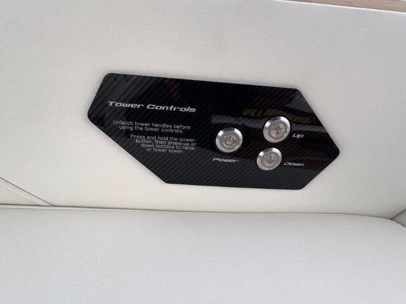 Slide: The Image of 2025 Nautique G25 tower controls with power, up, and down buttons. - 45