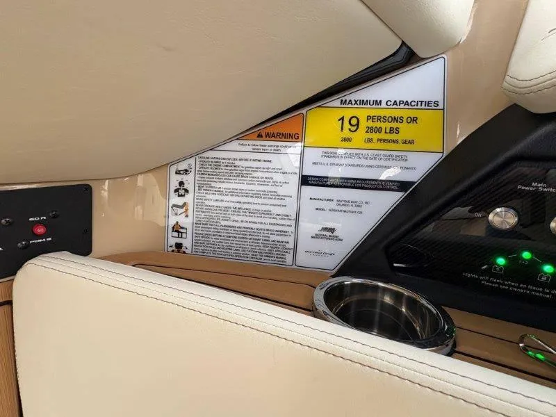Slide: The Image of 2025 Nautique G25 boat capacity label, seating for 19 people or 2800 lbs. - 48