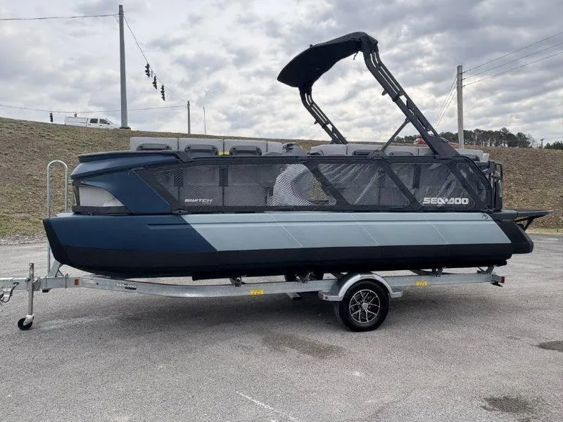 Slide: The Image of 2025 Sea-Doo Switch Cruise Limited 21' 230HP on trailer, parked outdoors. - 15
