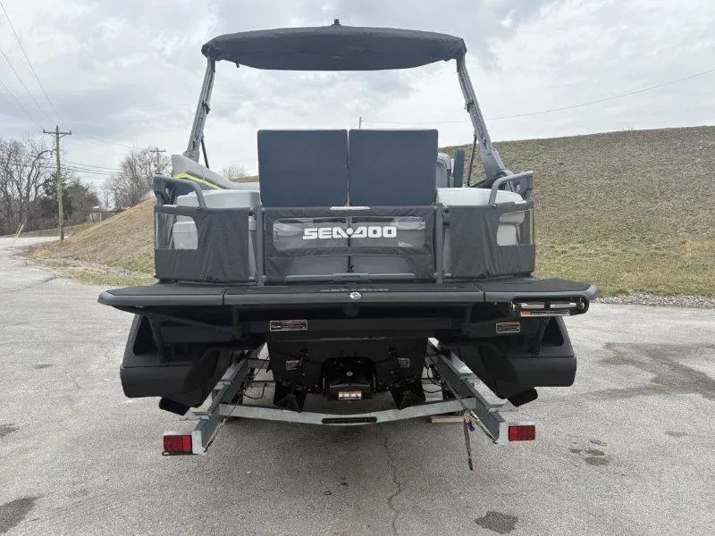 Slide: The Image of 2025 Sea-Doo Switch Cruise Limited 21' 230HP pontoon boat, rear view on trailer. - 16