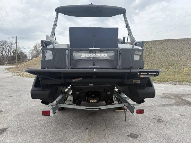 Slide: The Image of 2025 Sea-Doo Switch Cruise Limited 21' 230HP on trailer, rear view. - 18