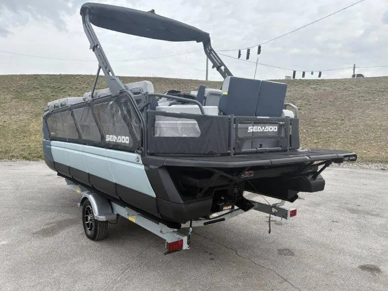 Slide: The Image of 2025 Sea-Doo Switch Cruise Limited 21' 230HP on trailer, rear view. - 21