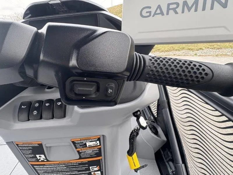 Slide: The Image of Close-up of 2025 Sea-Doo Switch Cruise Limited 21' 230HP handlebar controls with Garmin display. - 23