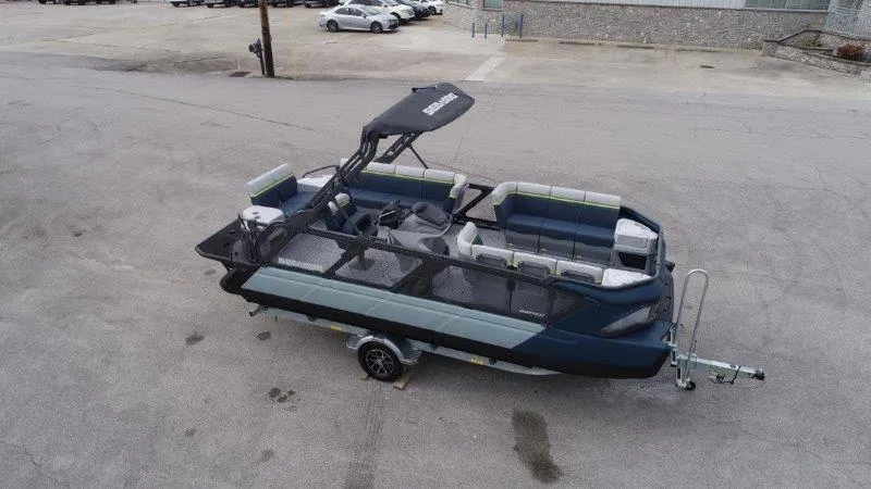 Slide: The Image of 2025 Sea-Doo Switch Cruise Limited 21' 230HP pontoon boat on trailer, parked outdoors. - 4