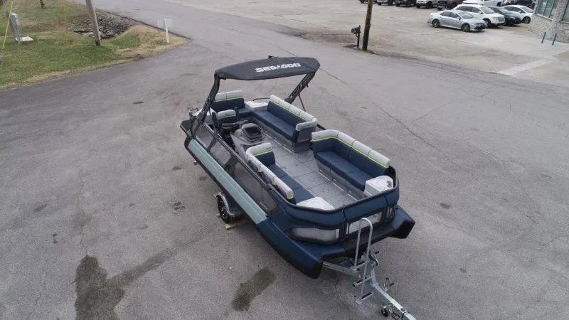 Slide: The Image of 2025 Sea-Doo Switch Cruise Limited 21' 230HP pontoon boat on trailer, aerial view. - 7