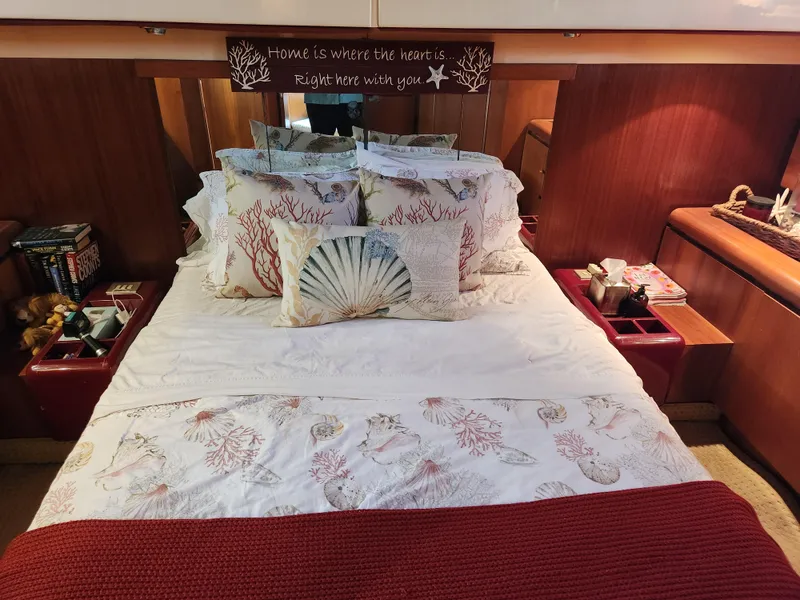 Slide: The Image of Cozy bedroom in 1987 Posillipo Technema 52 yacht with nautical-themed bedding. - 16