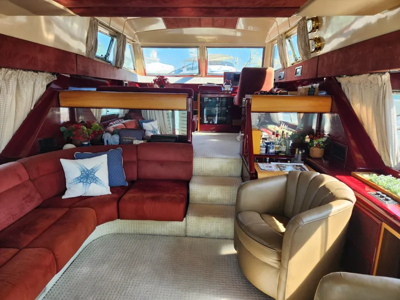 Slide: The Image of Luxurious interior of a 1987 Posillipo Technema 52 yacht with plush seating and elegant decor. - 23