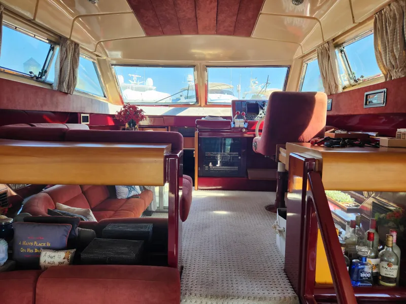Slide: The Image of Interior of 1987 Posillipo Technema 52 yacht with luxurious seating and panoramic windows. - 26