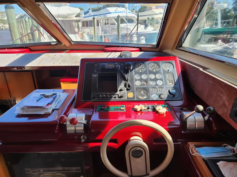 Slide: The Image of Cockpit of 1987 Posillipo Technema 52 yacht with steering wheel and control panel. - 29