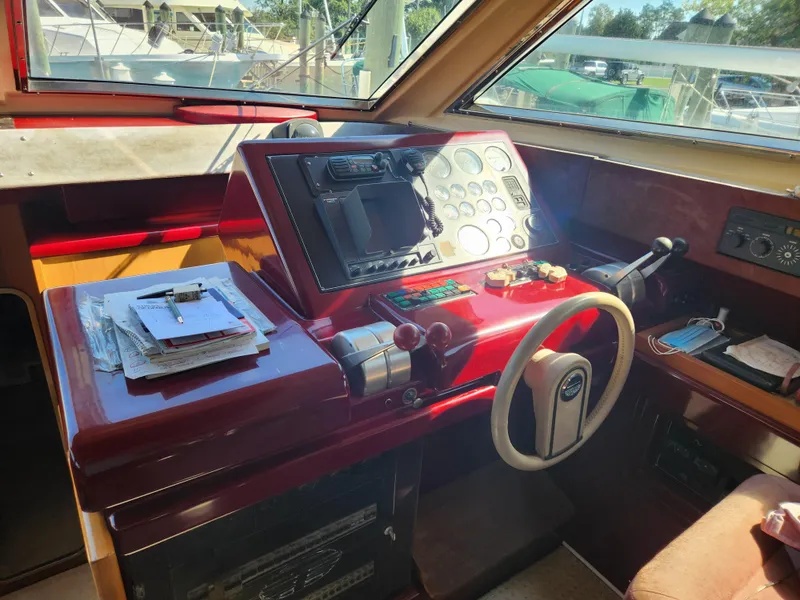 Slide: The Image of Cockpit of 1987 Posillipo Technema 52 yacht with steering wheel and control panel. - 30