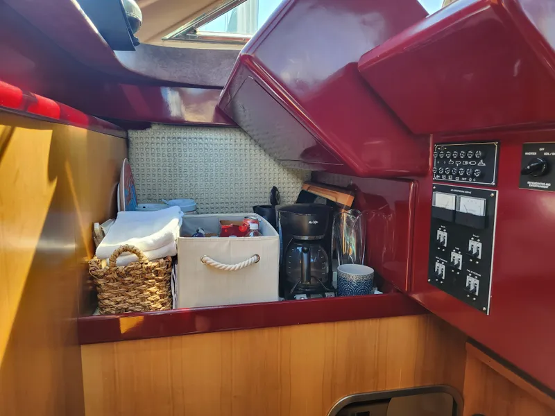 Slide: The Image of Interior of 1987 Posillipo Technema 52 yacht with kitchen essentials and control panel. - 32