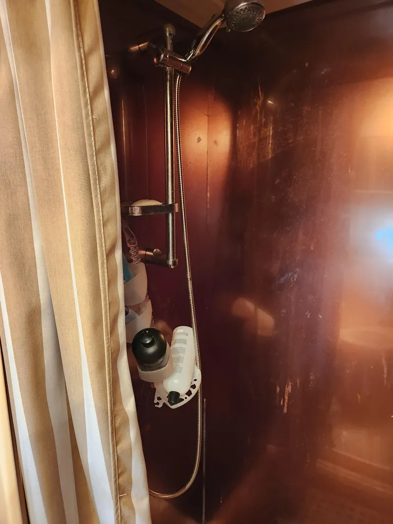 Slide: The Image of Shower area inside 1987 Posillipo Technema 52 yacht with curtain and showerhead. - 38