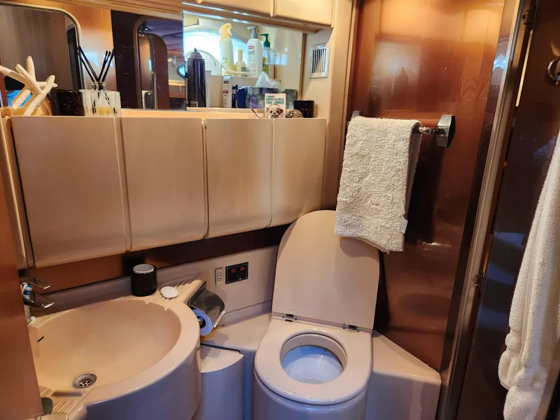 Slide: The Image of Bathroom interior of 1987 Posillipo Technema 52 yacht, featuring sink and toilet. - 44