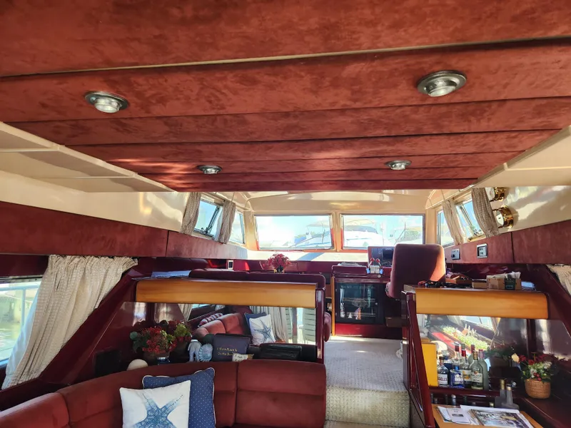 Slide: The Image of Luxurious interior of a 1987 Posillipo Technema 52 yacht with plush seating and elegant decor. - 47