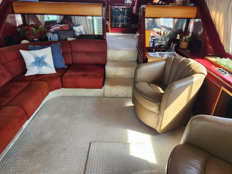 Slide: The Image of Luxurious interior of a 1987 Posillipo Technema 52 yacht with plush seating and elegant decor. - 48