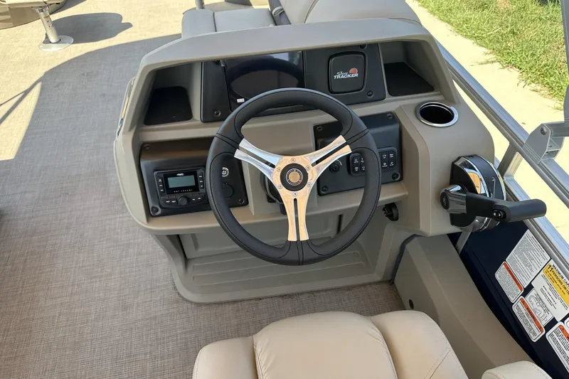 Slide: The Image of Steering console of 2025 Sun Tracker Fishin' Barge 22 DLX pontoon boat. - 18