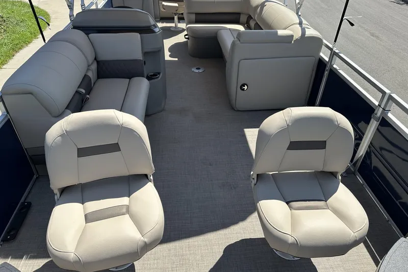 Slide: The Image of 2025 Sun Tracker Fishin' Barge 22 DLX interior with comfortable seating and spacious layout. - 8
