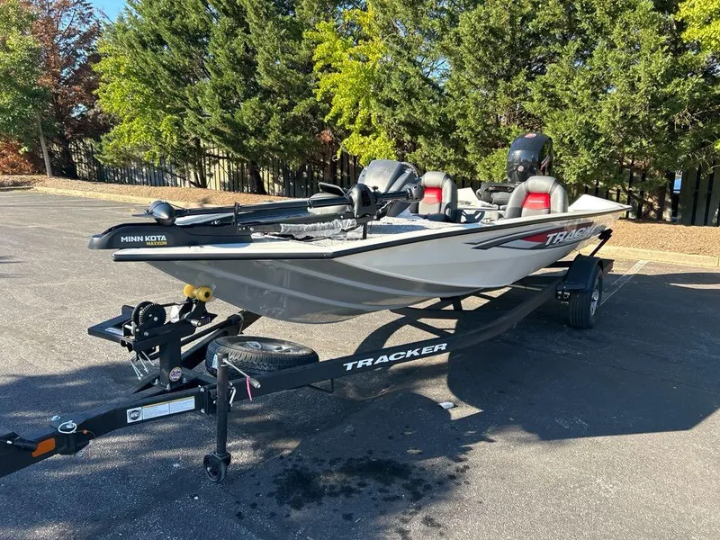 Slide: The Image of 2025 Tracker Pro Team 195 Tournament Edition boat on trailer, parked outdoors. - 3