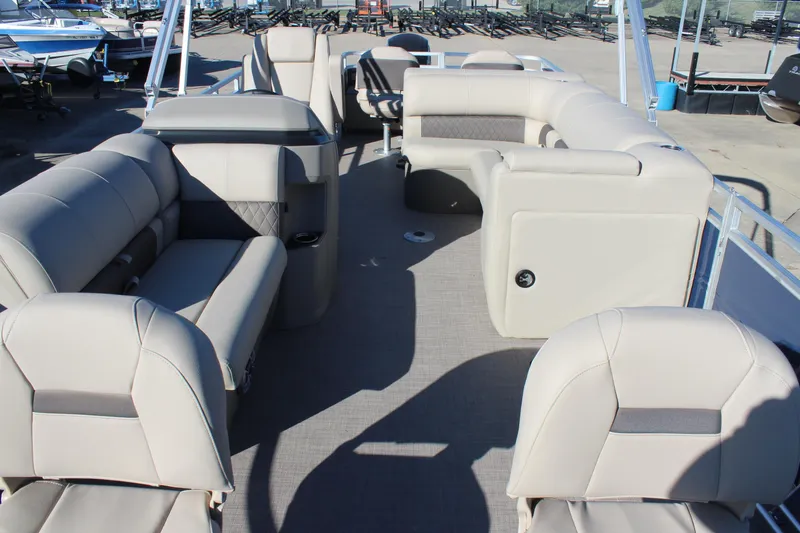Slide: The Image of 2025 Sun Tracker Fishin' Barge 22 DLX interior with spacious seating and modern design. - 8