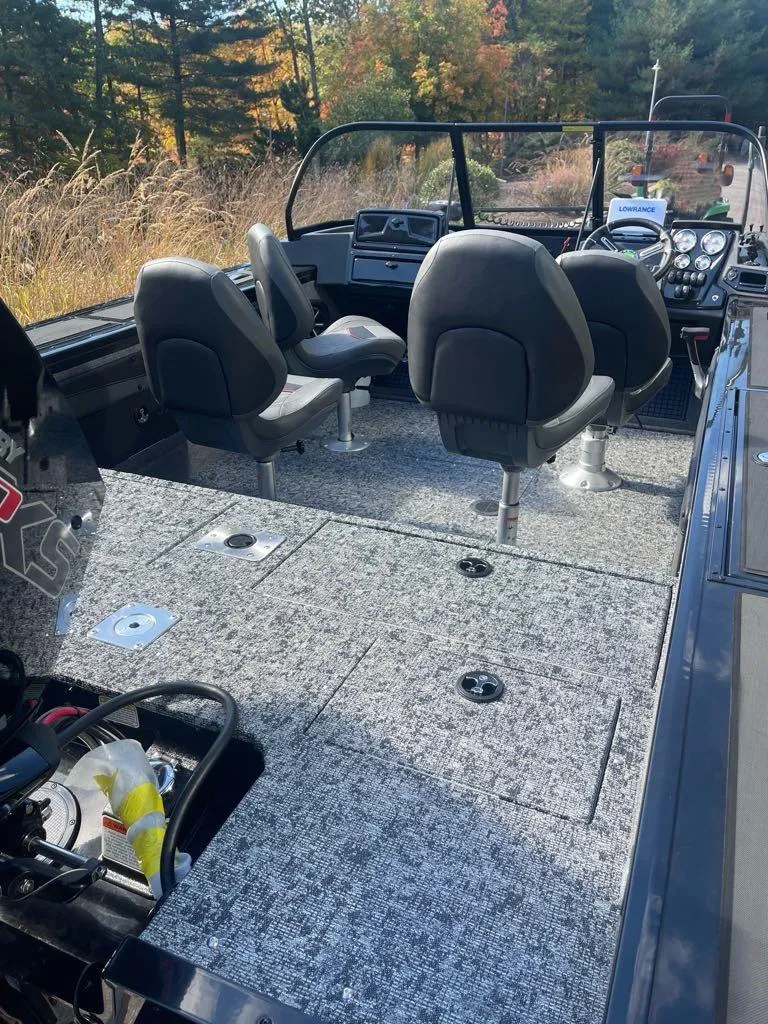 Slide: The Image of 2025 Tracker Targa V-19 WT boat interior with seating and control panel. - 3