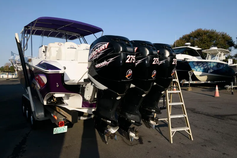 Slide: The Image of 2003 Fountain 38 Center Console boat with triple Mercury 275 Verado engines. - 13