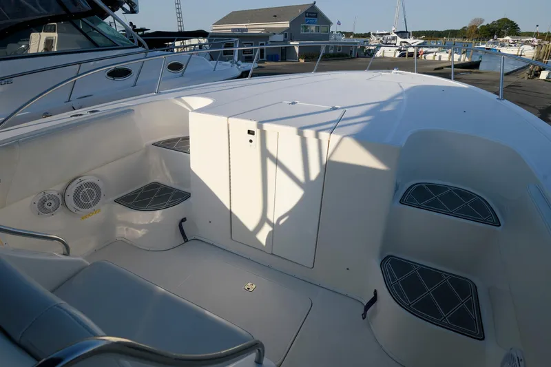 Slide: The Image of 2003 Fountain 38 Center Console boat interior with seating and storage compartments. - 14
