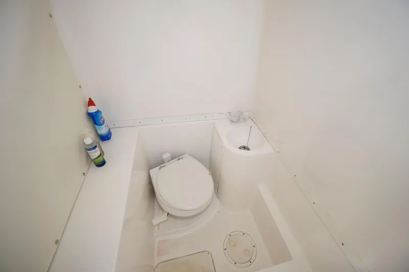 Slide: The Image of Compact marine bathroom in 2003 Fountain 38 Center Console boat. - 21