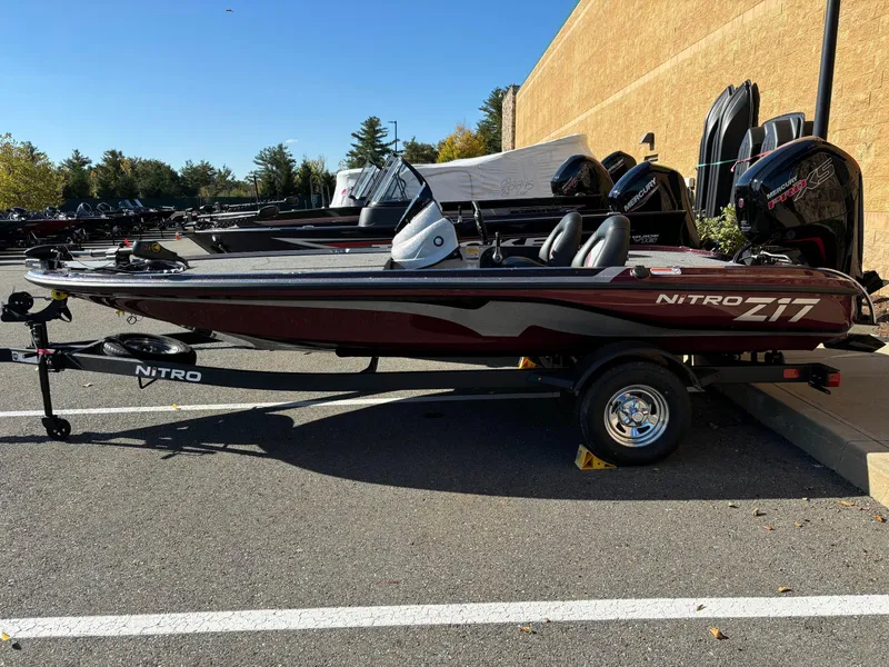 Slide: The Image of 2025 Nitro Z17 boat parked outdoors on a trailer. - 0