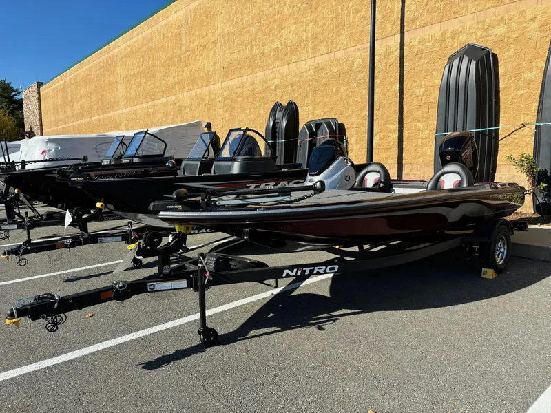 Slide: The Image of 2025 Nitro Z17 boat displayed in a parking lot, showcasing sleek design and modern features. - 1