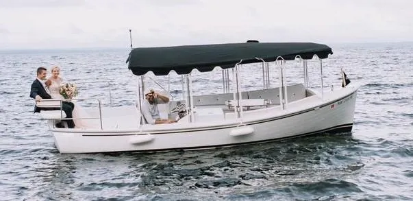 The Image of 2020 Duffy Suncruiser 22 boat with passengers on a calm sea. - 1