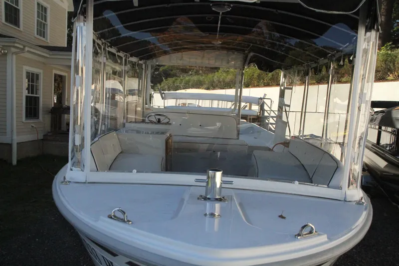 Slide: The Image of 2020 Duffy Suncruiser 22 electric boat with spacious seating and clear canopy. - 9