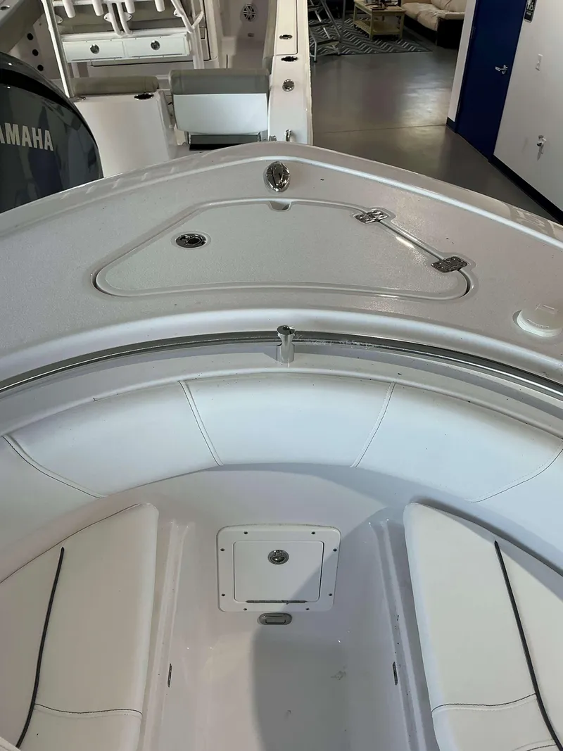 Slide: The Image of 2025 Sportsman 232 Open boat interior with seating and storage compartments. - 13