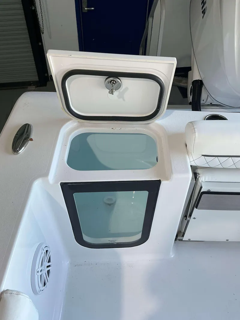 Slide: The Image of Open storage compartment on 2025 Sportsman 232 Open boat. - 6
