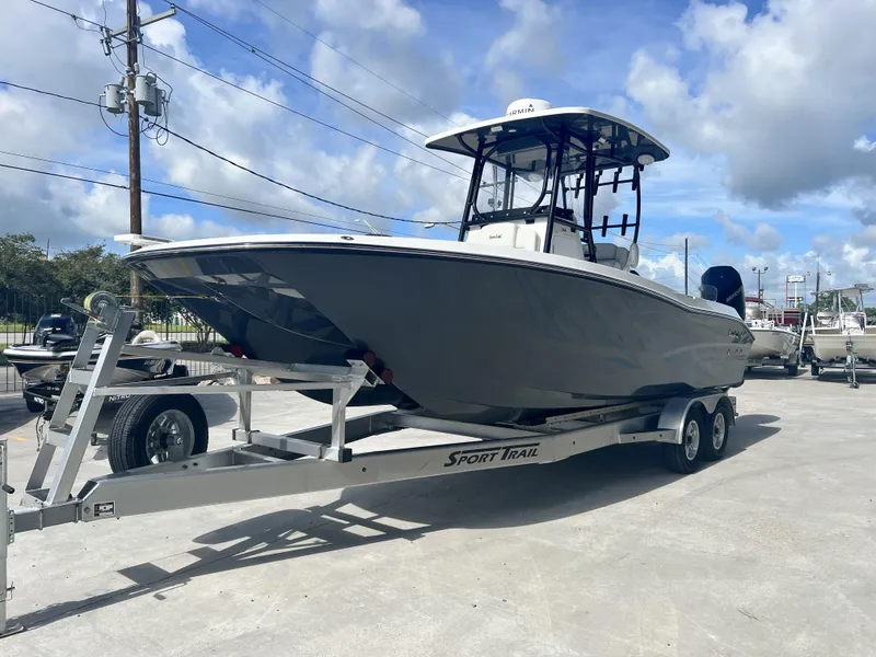 Slide: The Image of 2023 Sea Cat 260 HC boat on trailer under blue sky. - 3