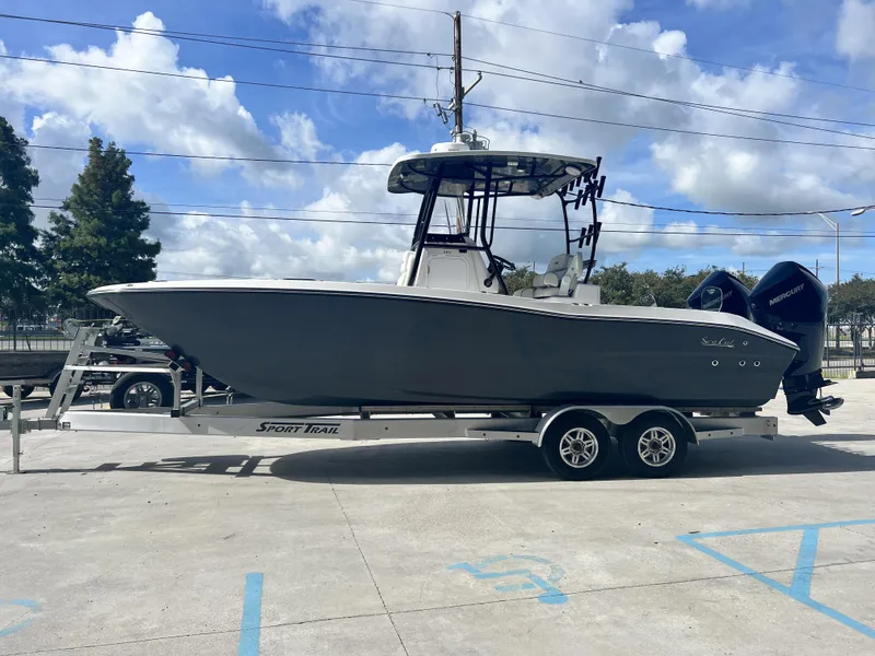 Slide: The Image of 2023 Sea Cat 260 HC boat on trailer under blue sky. - 4