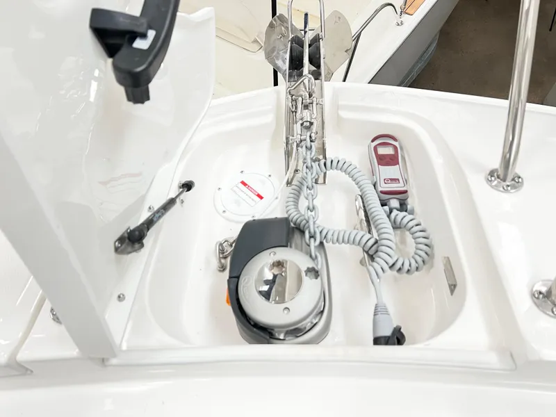 Slide: The Image of Anchor compartment of 2025 Sea Ray Sundancer 320 boat with coiled rope and equipment. - 10