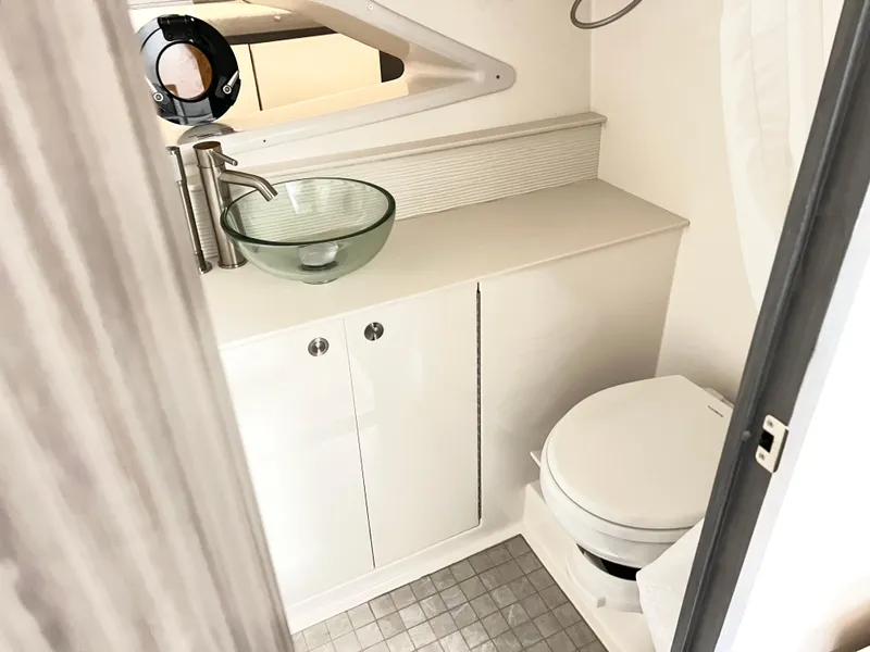 Slide: The Image of Modern bathroom in 2025 Sea Ray Sundancer 320 yacht with glass sink and toilet. - 14