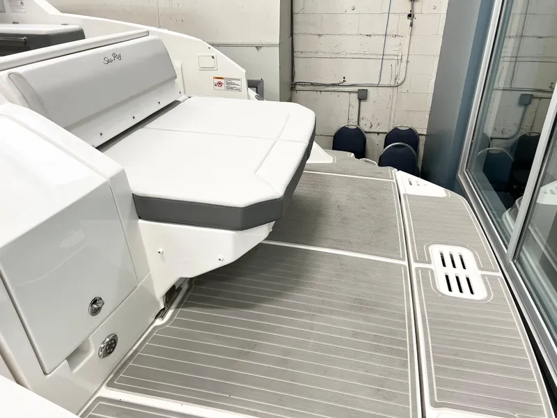 Slide: The Image of 2025 Sea Ray Sundancer 320 boat deck with seating area, modern design. - 3