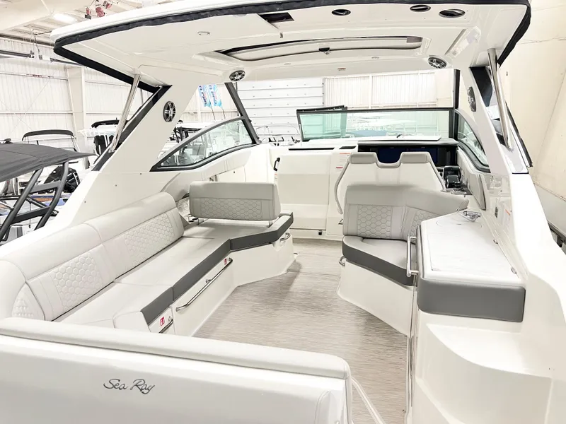 Slide: The Image of 2025 Sea Ray Sundancer 320 interior, featuring sleek seating and modern design in a spacious cabin. - 4