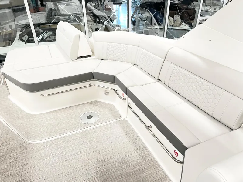 Slide: The Image of Luxurious seating on 2025 Sea Ray Sundancer 320 yacht, featuring elegant white upholstery. - 6