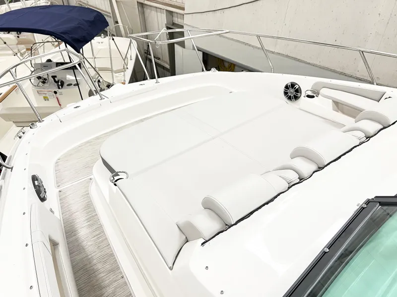 Slide: The Image of 2025 Sea Ray Sundancer 320 boat with spacious sun deck and sleek design. - 9