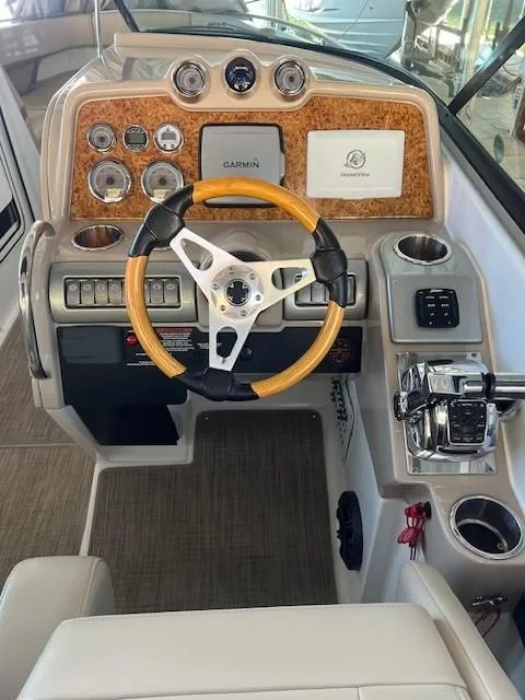 Slide: The Image of 2012 Formula 310 Bowrider I/O dashboard with wood accents and Garmin navigation. - 12