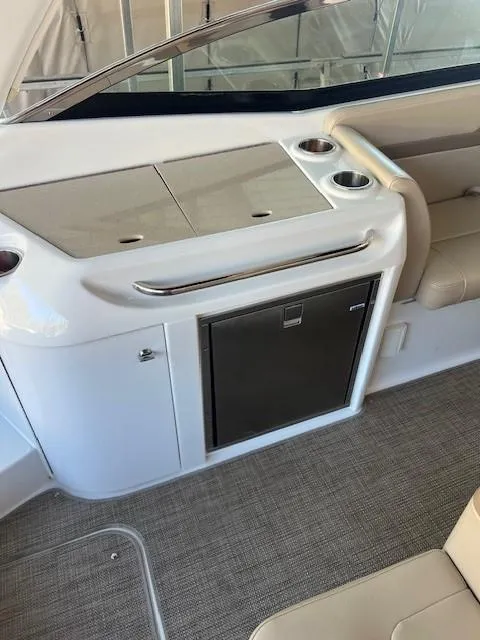 Slide: The Image of 2012 Formula 310 Bowrider I/O interior with seating and built-in storage. - 13