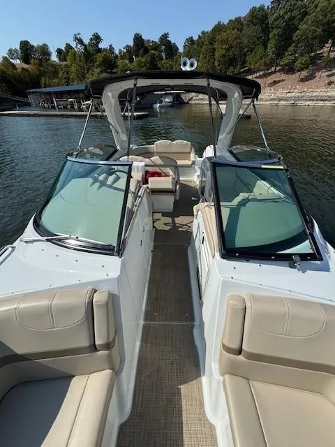 Slide: The Image of 2012 Formula 310 Bowrider I/O on a serene lake with lush greenery. - 18