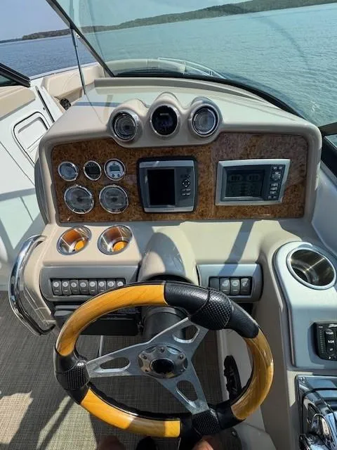Slide: The Image of 2012 Formula 310 Bowrider I/O dashboard with wood accents and modern controls. - 23