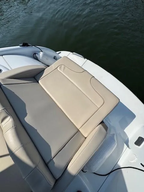 Slide: The Image of 2012 Formula 310 Bowrider I/O boat with beige seating, near water. - 26