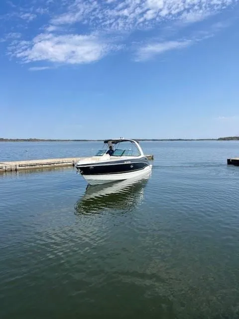 Slide: The Image of 2012 Formula 310 Bowrider I/O on calm lake under blue sky. - 4
