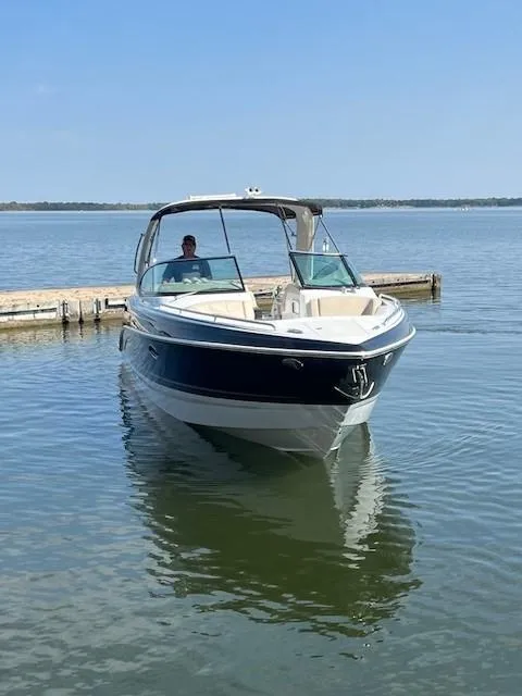 Slide: The Image of 2012 Formula 310 Bowrider I/O on calm lake near dock. - 6